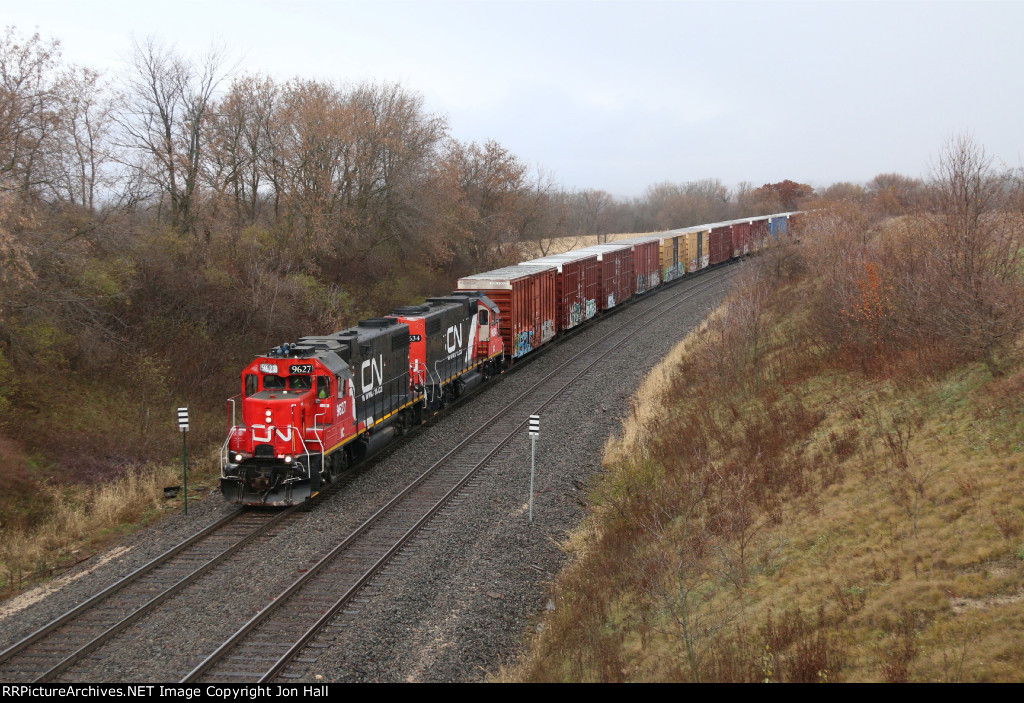 L508 comes south toward the top of the hill with cars for Quad Graphics